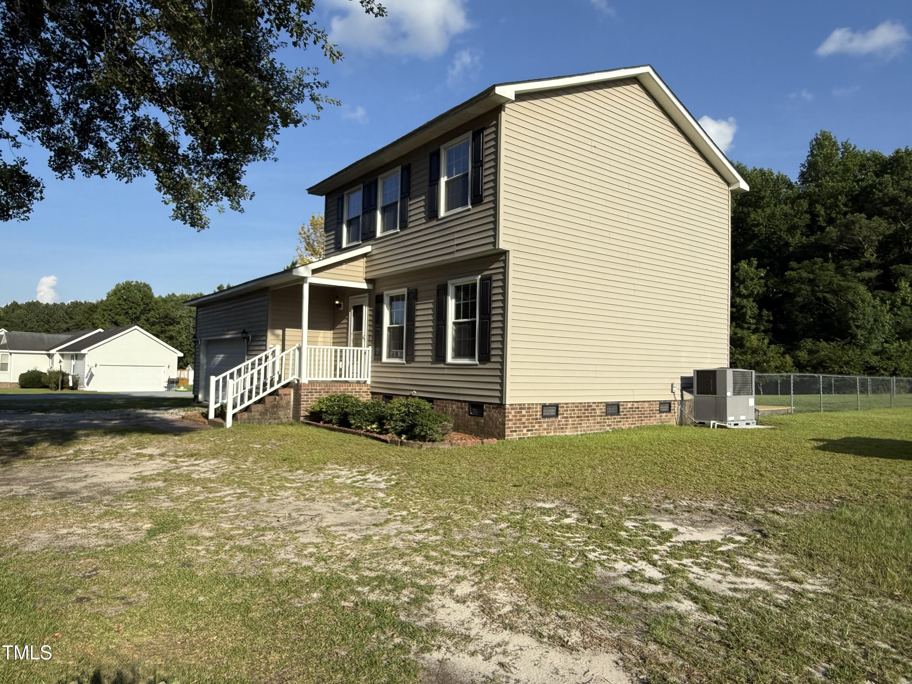 152 Christopher Avenue Princeton, NC 27569 - Photo 5 of 24 a view of a house with a yard