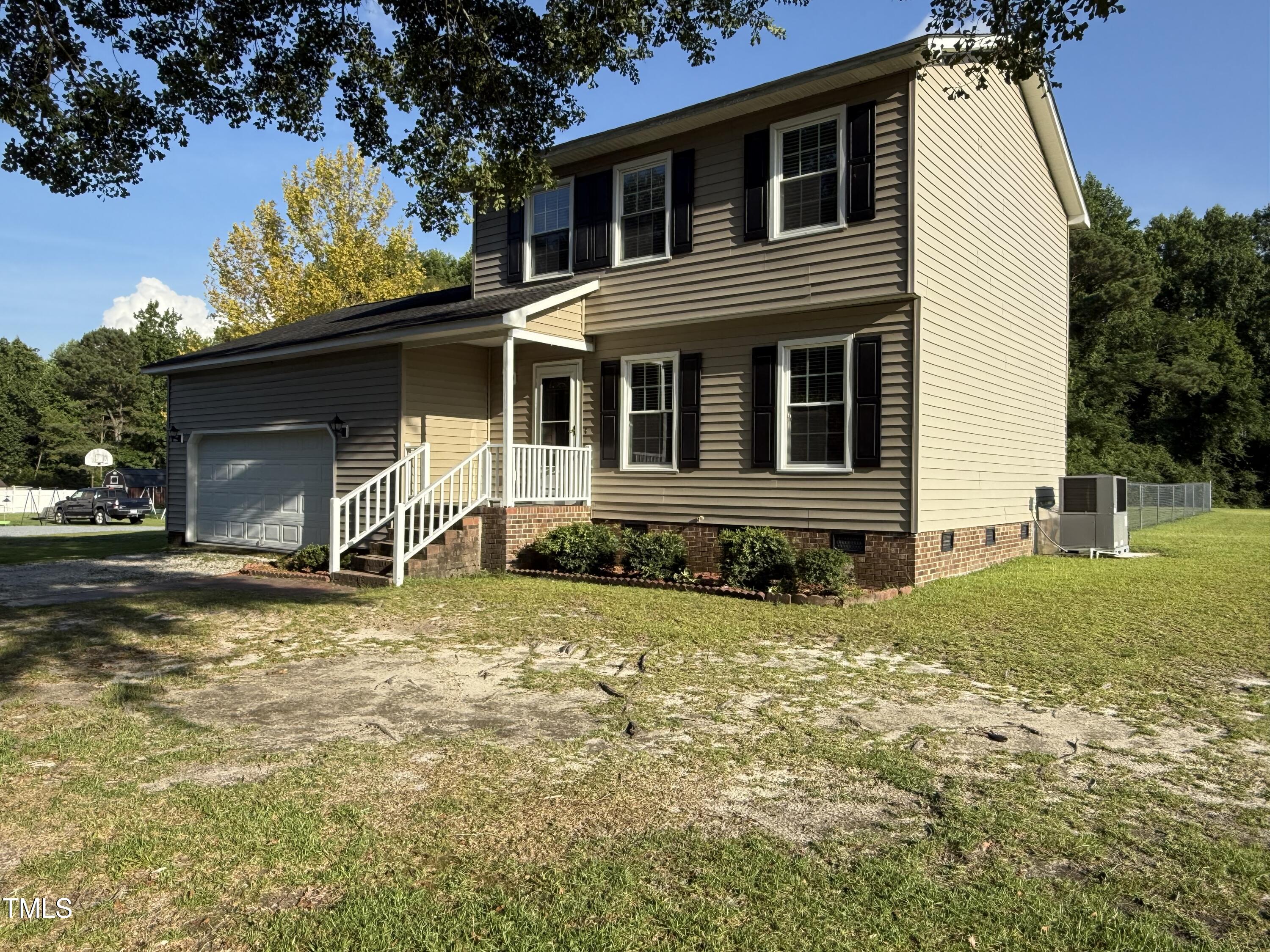152 Christopher Avenue Princeton, NC 27569 - Photo 7 of 24 a view of a house with a yard