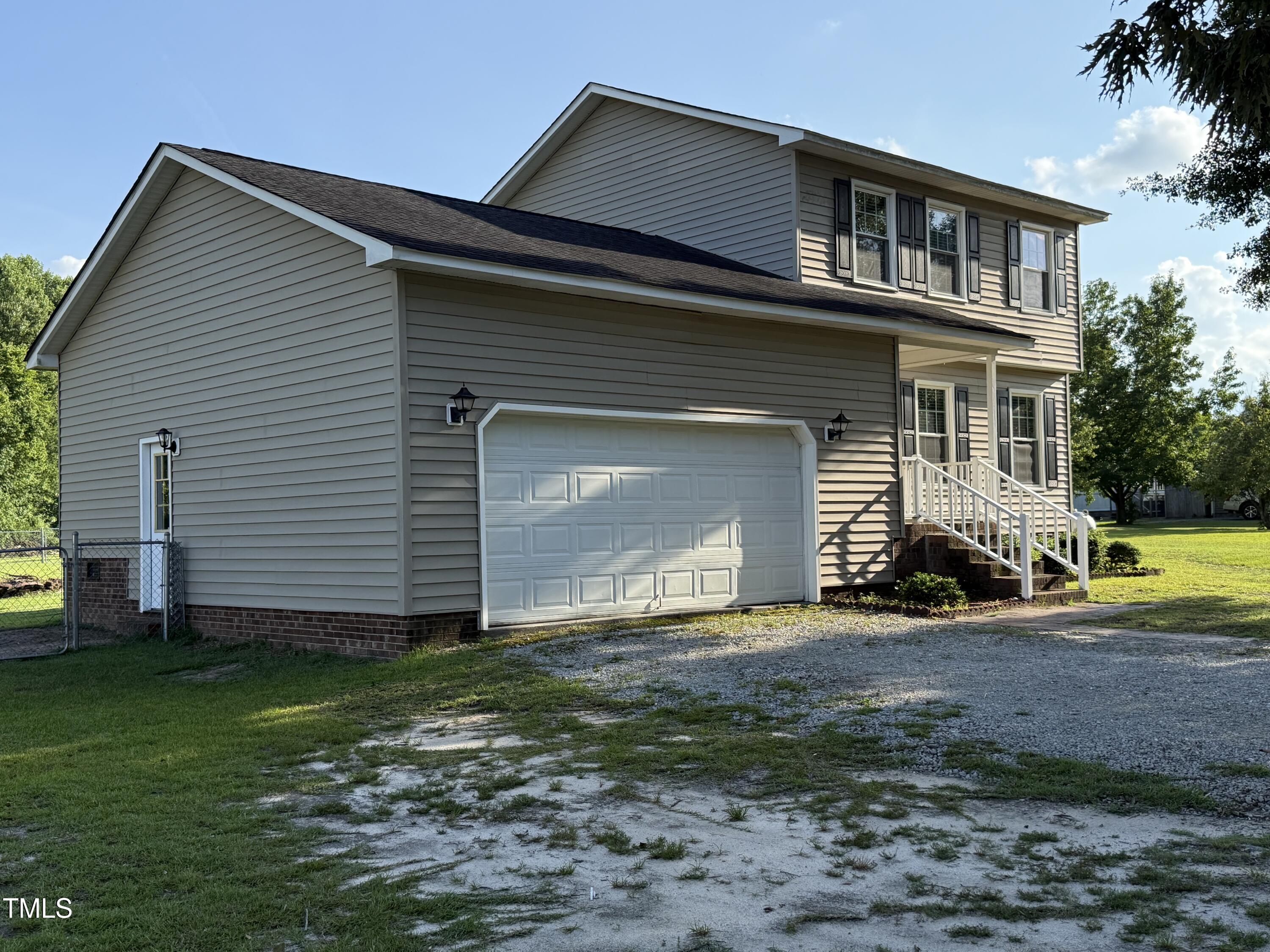 152 Christopher Avenue Princeton, NC 27569 - Photo 8 of 24 a front view of a house with garden