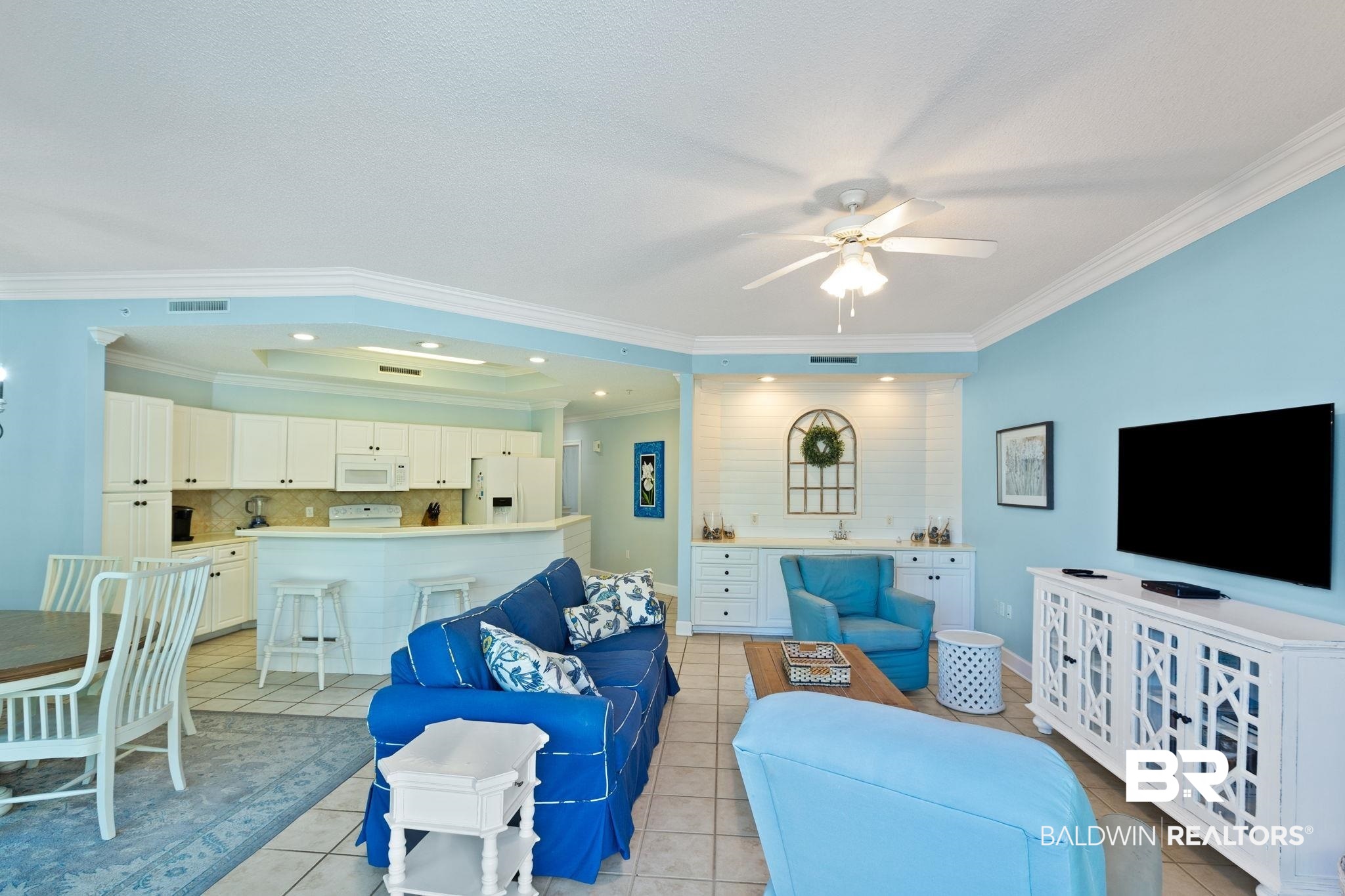 27580 Canal Road, Unit 1112 Orange Beach, AL 36561 - Photo 6 of 50 Living room featuring light tile patterned flooring, ornamental molding, ceiling fan, and recessed lighting