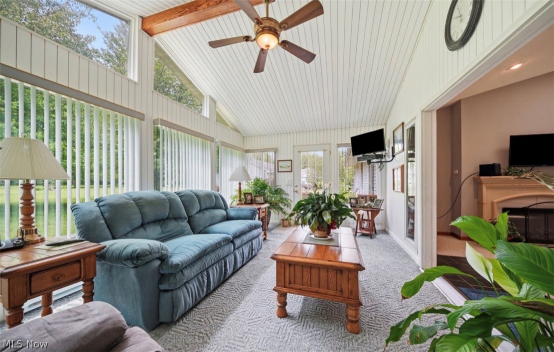 3556 Lake Road Conneaut, OH 44030 - Photo 18 of 39 Sunroom featuring a vaulted ceiling with exposed wood beams and a ceiling fan