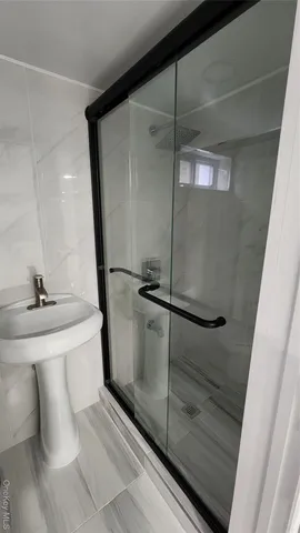 a white toilet sitting next to a bathroom sink