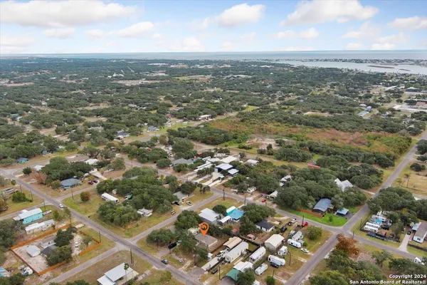 an aerial view of city and mountain