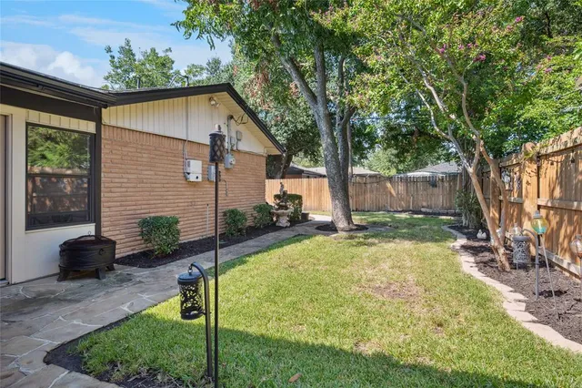 a backyard of a house with seating space