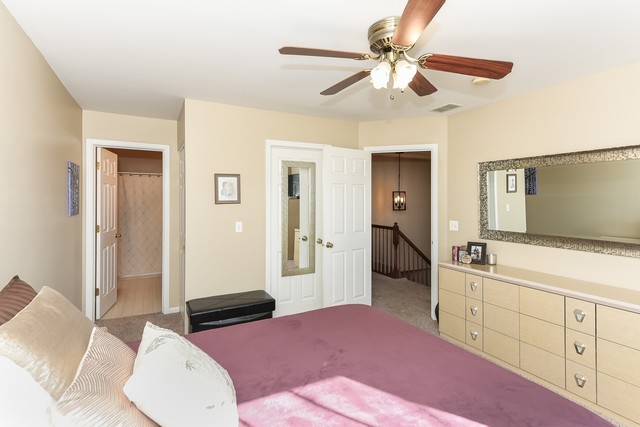 1089 Horizon Ridge Lake In The Hills, IL 60156 - Photo 14 of 23 a bedroom with a bed and a flat tv screen on dresser