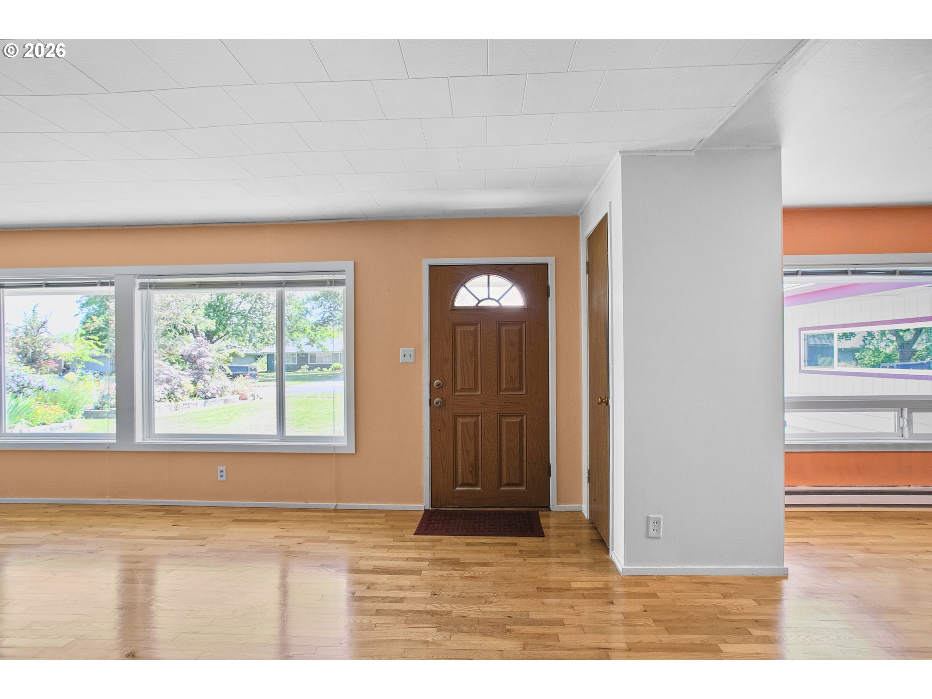2840 Ferry Street Eugene, OR 97405 - Photo 7 of 35 a view of an empty room with wooden floor and a window