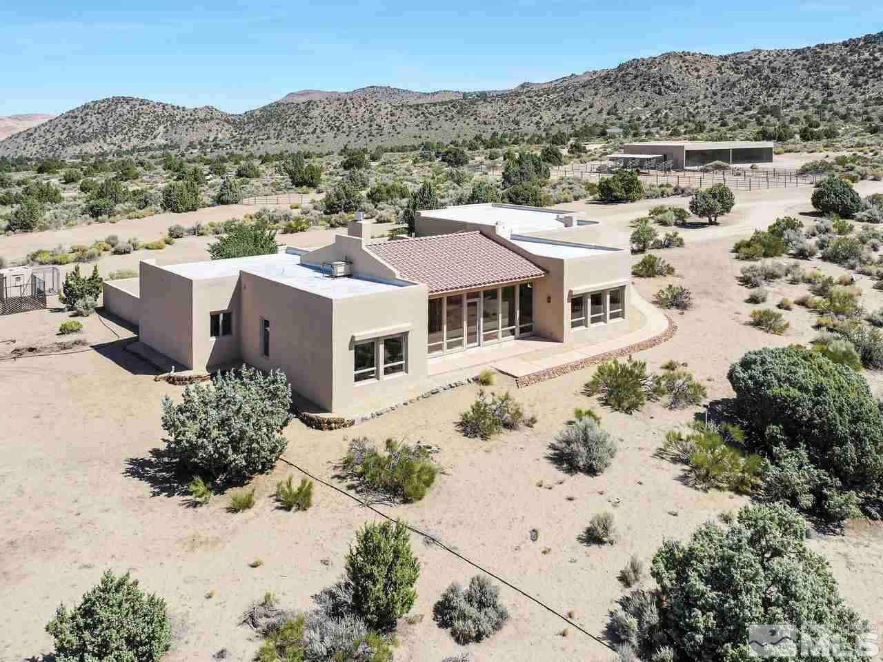 7280 Sage Canyon Road Reno, NV 89510 - Photo 1 of 23 a view of a house with a yard covered in snow