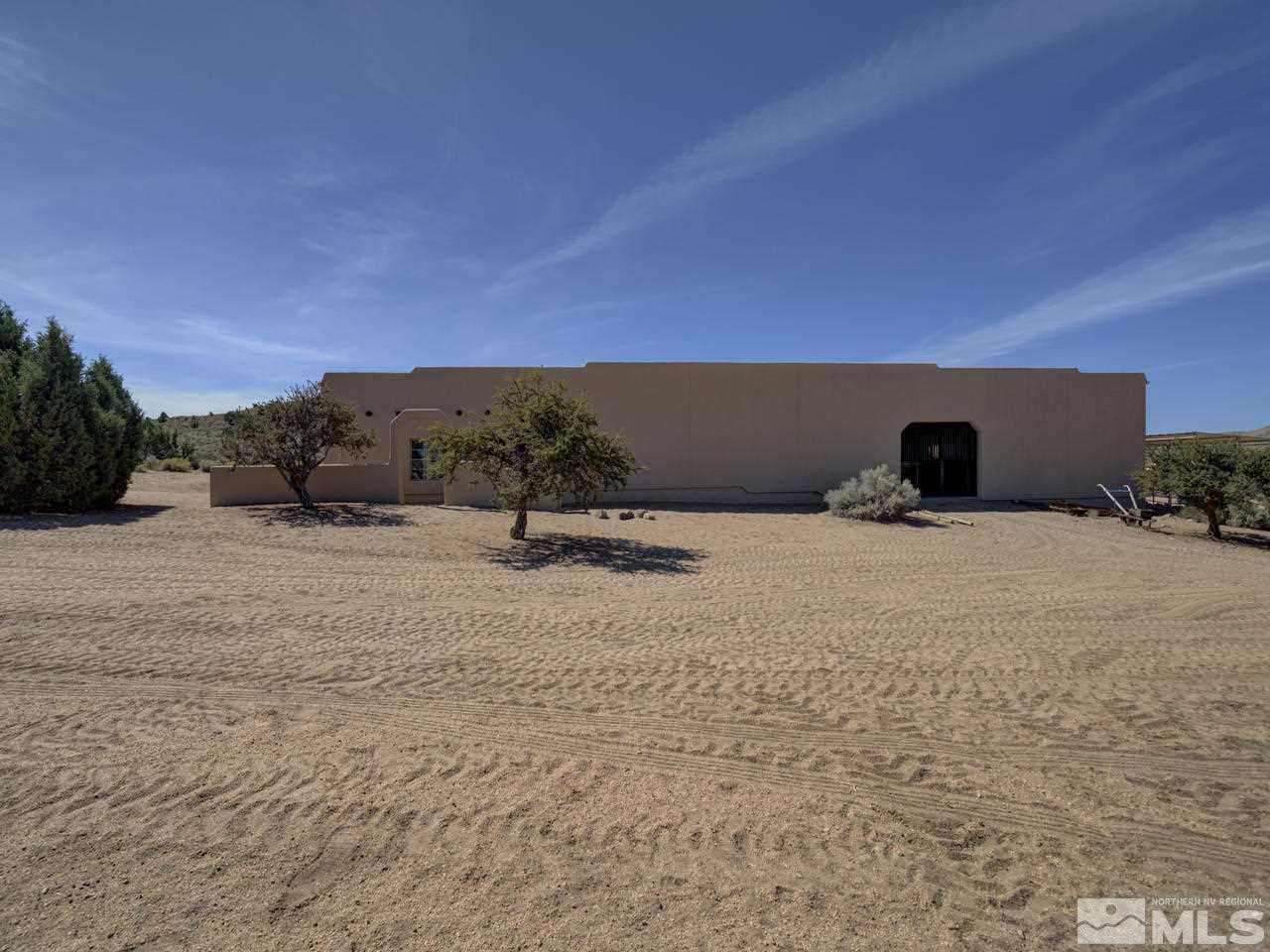 7280 Sage Canyon Road Reno, NV 89510 - Photo 14 of 23 a view of three house with a yard