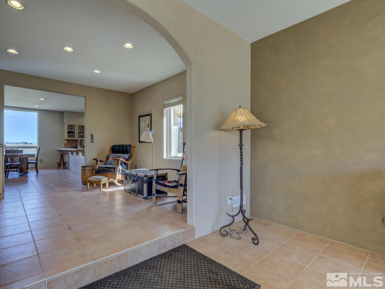7280 Sage Canyon Road Reno, NV 89510 - Photo 4 of 23 a living room with furniture and a table