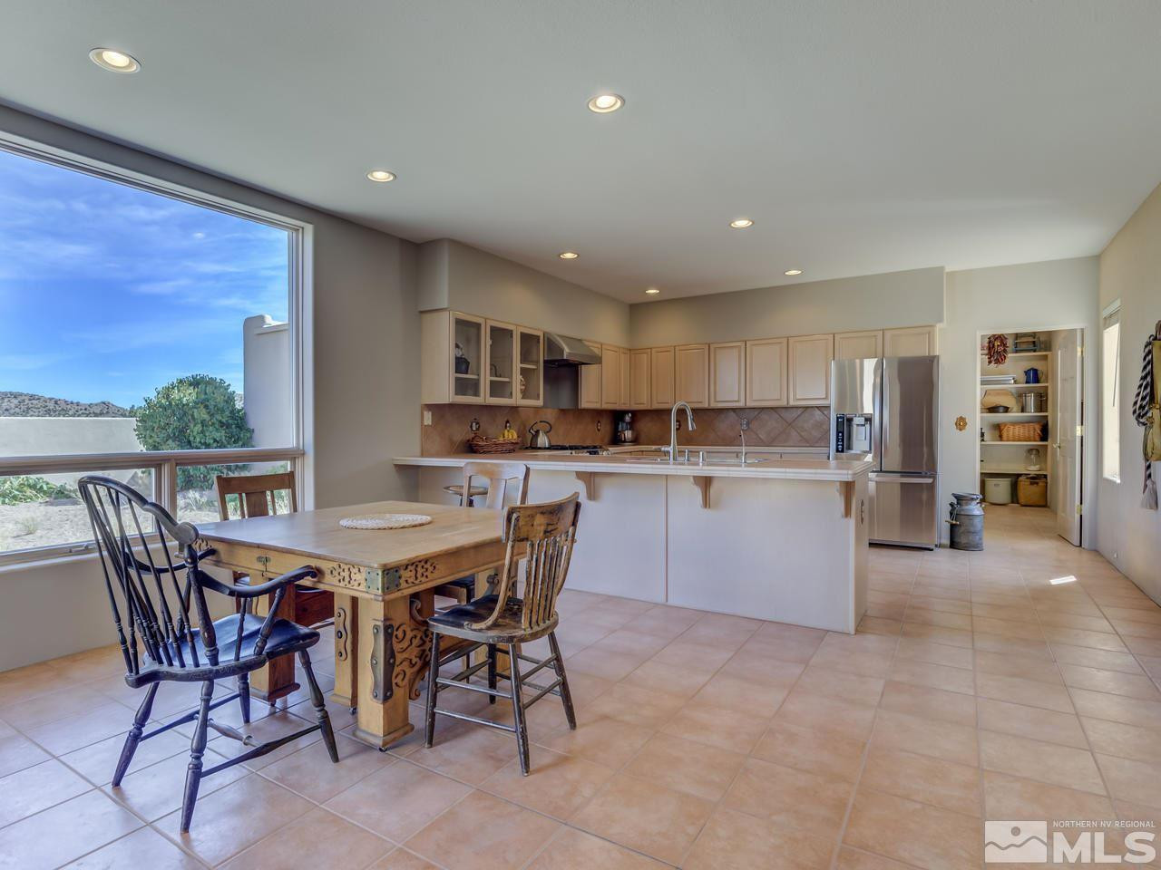 7280 Sage Canyon Road Reno, NV 89510 - Photo 6 of 23 a view of a dining room kitchen and a window