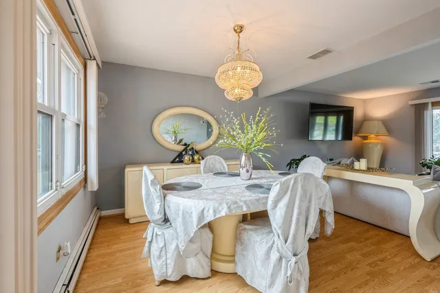 a view of a dining room and a chandelier