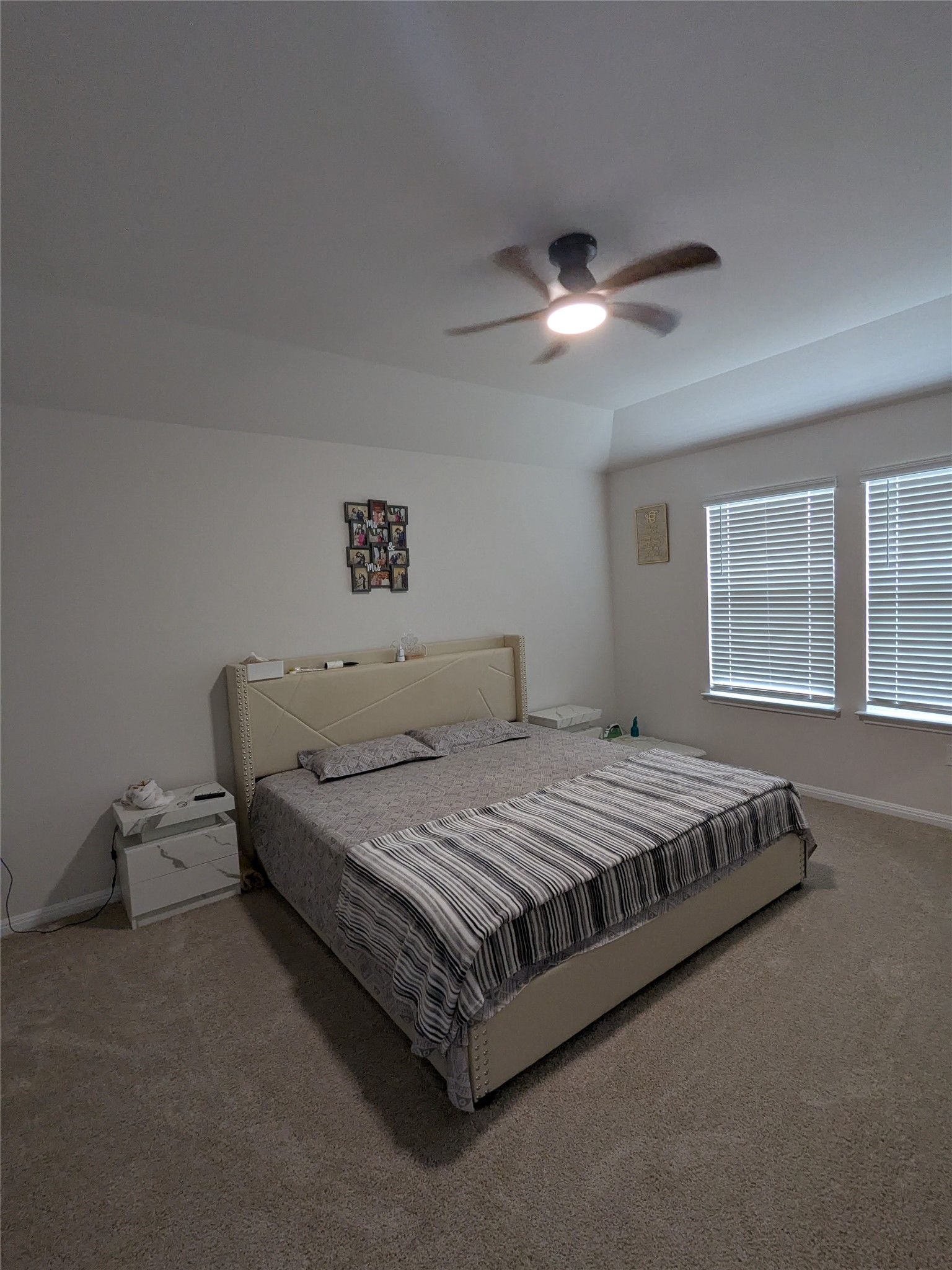 2412 Lightning View Leander, TX 78641 - Photo 14 of 24 A comfortable bedroom with vaulted ceilings and ample natural light offers a tranquil retreat.