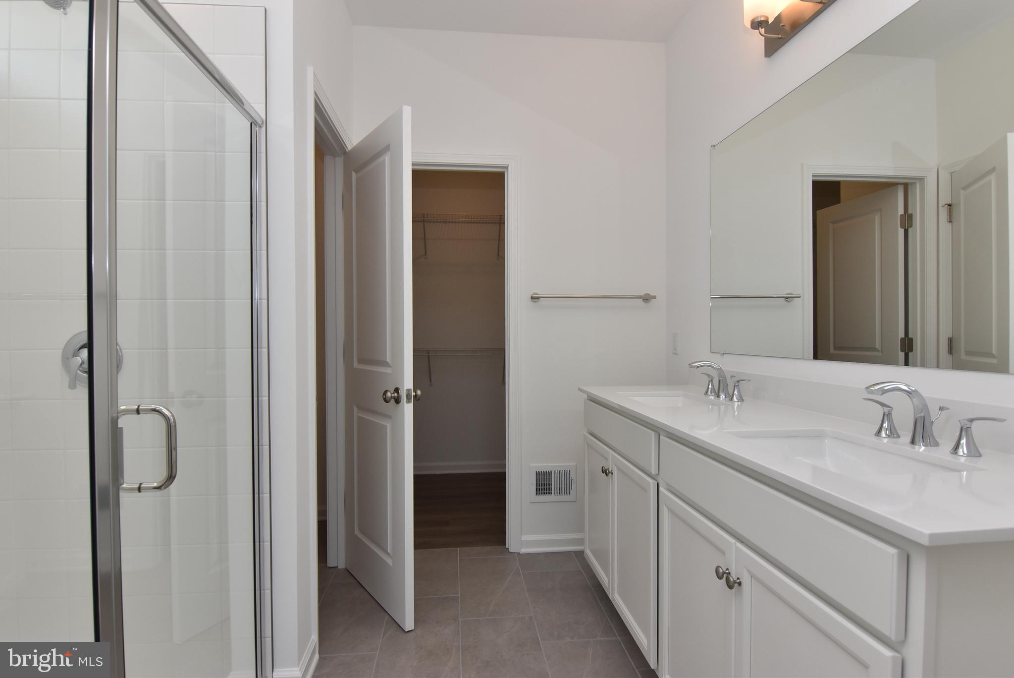 36366 Gate Drive Georgetown, DE 19947 - Photo 11 of 23 a bathroom with a double vanity sink mirror and