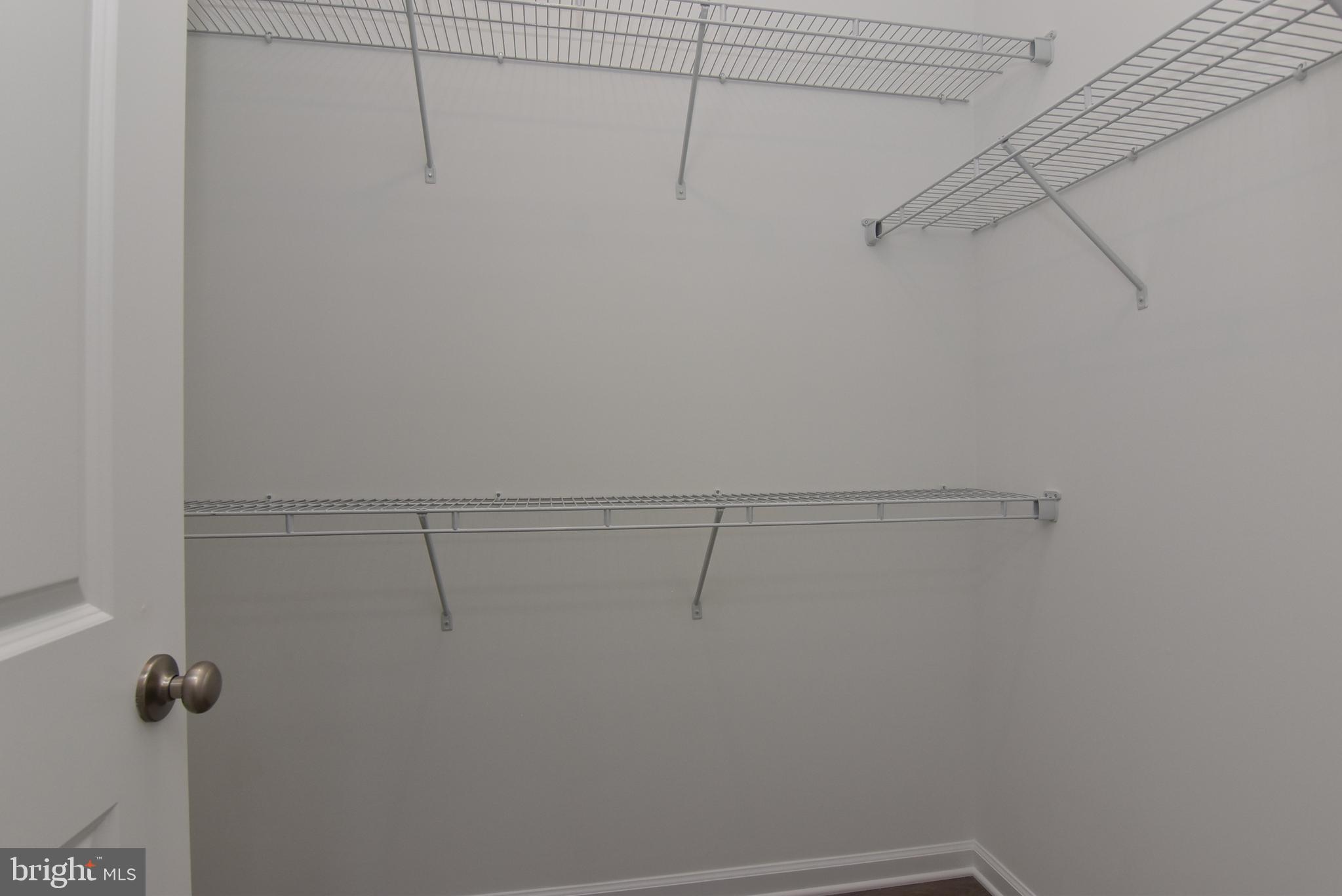 36366 Gate Drive Georgetown, DE 19947 - Photo 12 of 23 a view of a room with racks on the wall