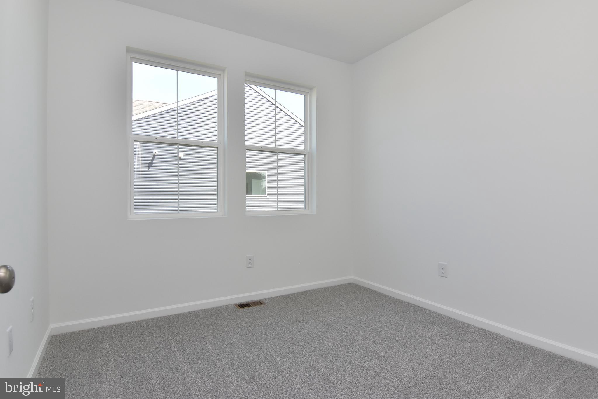 36366 Gate Drive Georgetown, DE 19947 - Photo 16 of 23 an empty room with a window
