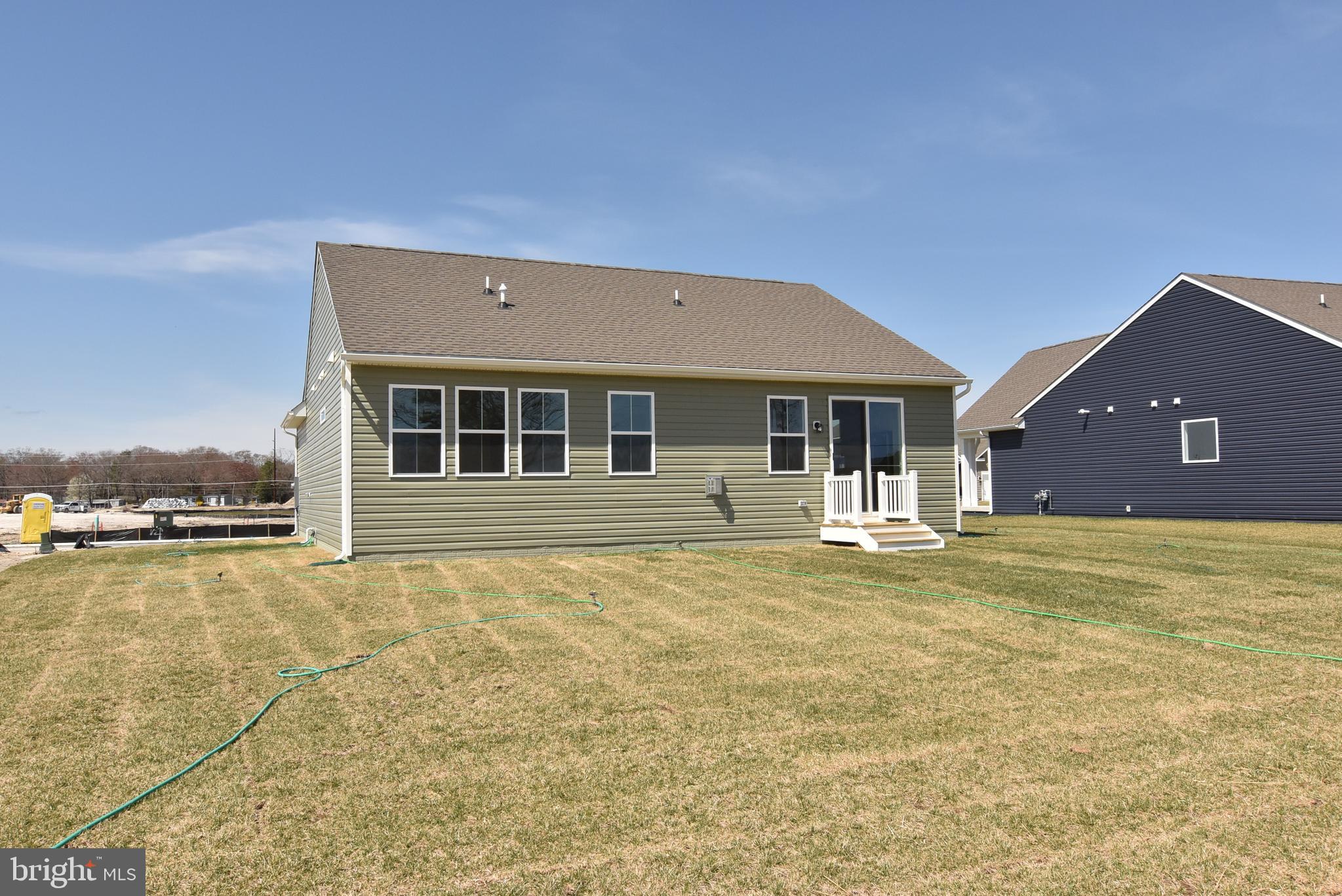 36366 Gate Drive Georgetown, DE 19947 - Photo 21 of 23 a front view of a house with a yard