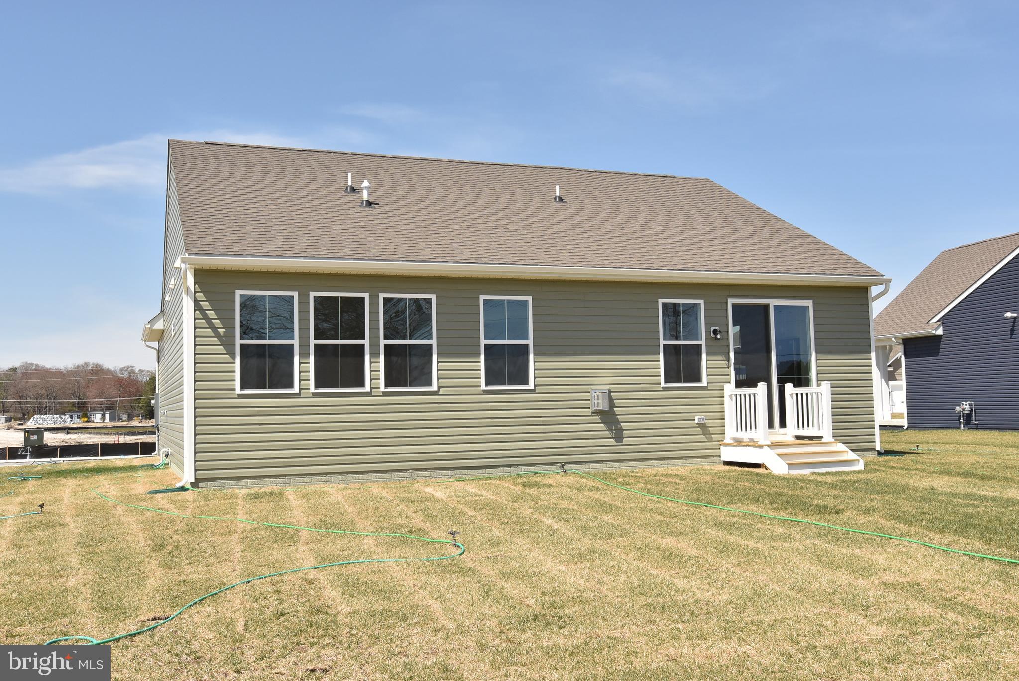 36366 Gate Drive Georgetown, DE 19947 - Photo 22 of 23 a view of a house with a outdoor space