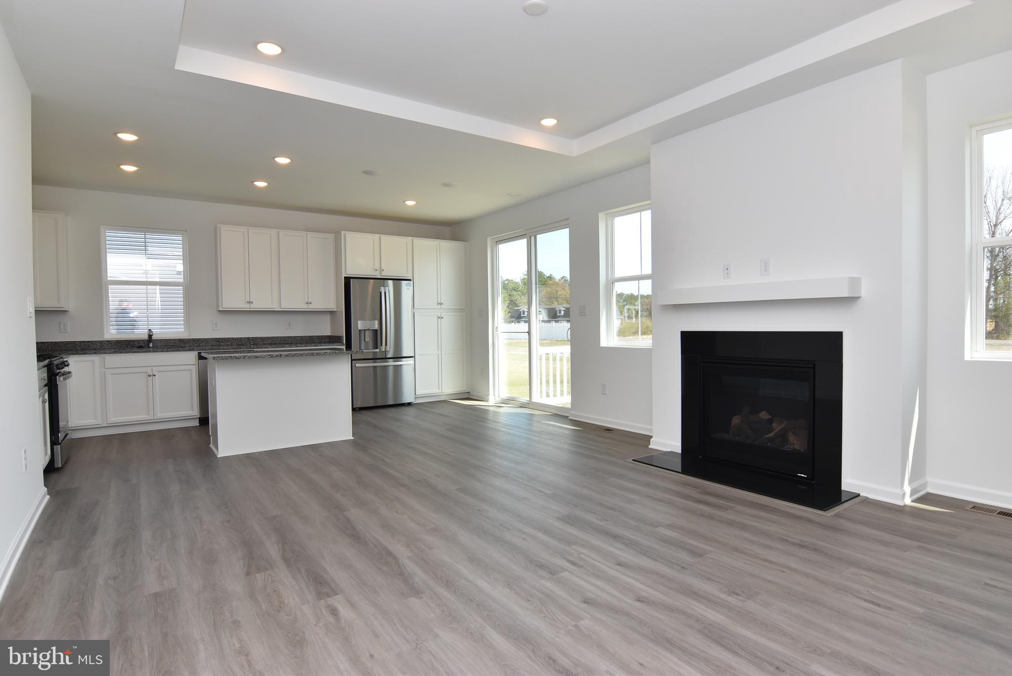 36366 Gate Drive Georgetown, DE 19947 - Photo 3 of 23 a view of a kitchen with a sink and a stove top oven