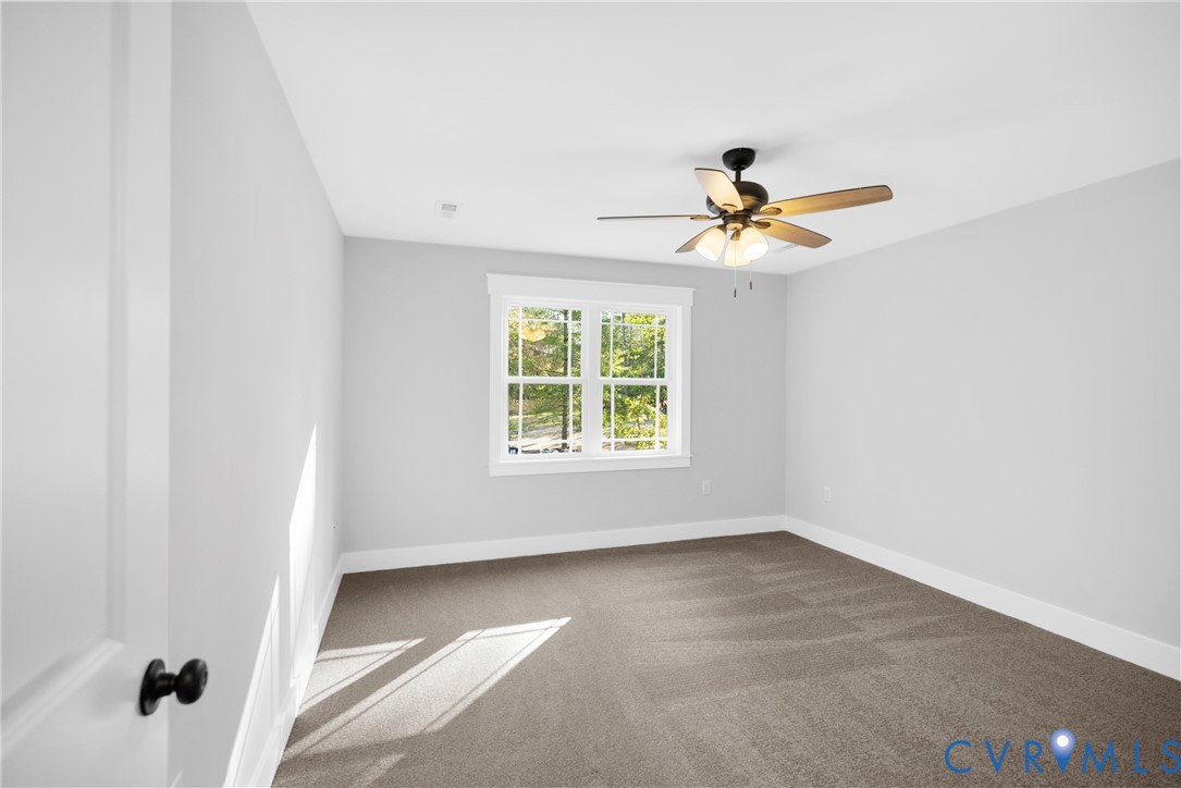 19106 Carson Road Dinwiddie, VA 23841 - Photo 23 of 34 Upstairs bedroom (2) Neutral-toned wall paint with