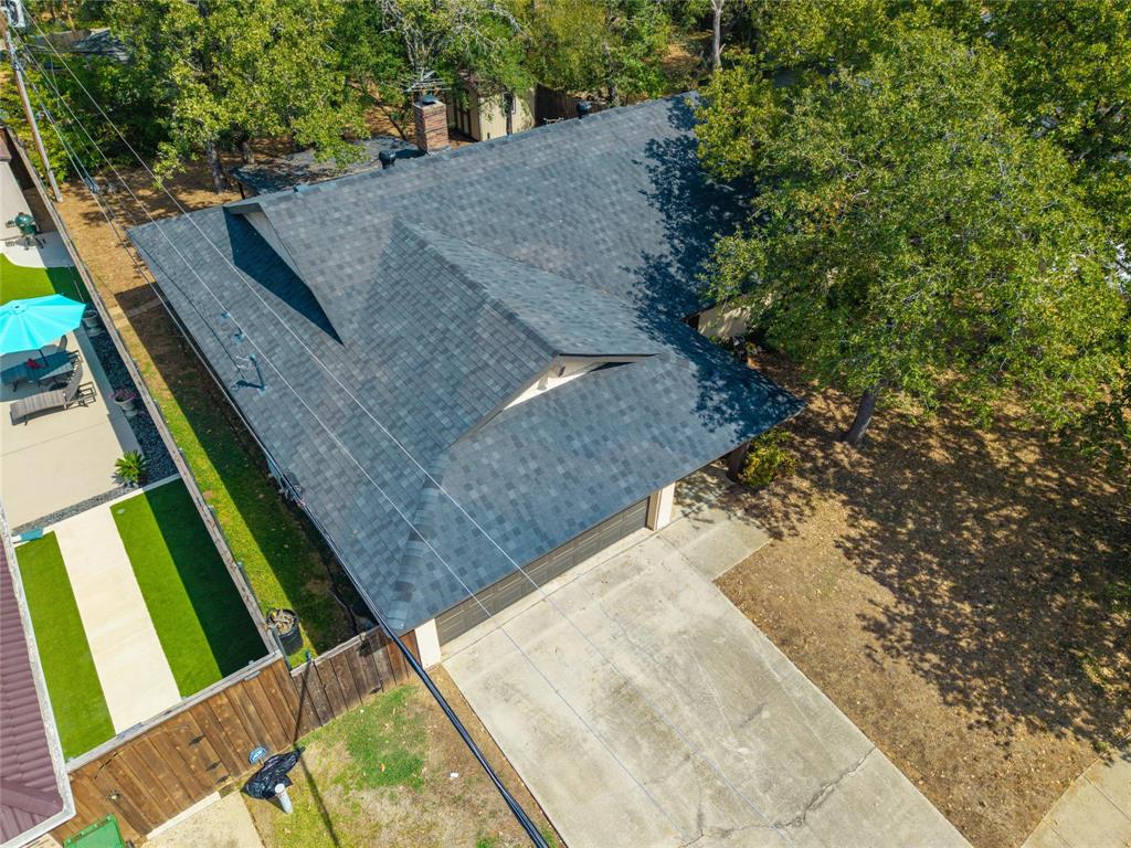 608 Ridgewood Circle Hurst, TX 76054 - Photo 37 of 38 Asphalt shingle roof with multiple gables