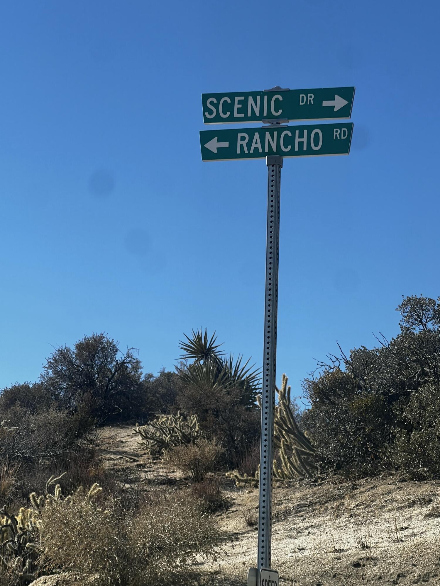 0 Rancho Rd Mountain Center Mountain Center, CA 92561 - Photo 4 of 8 a street sign that is on a pole