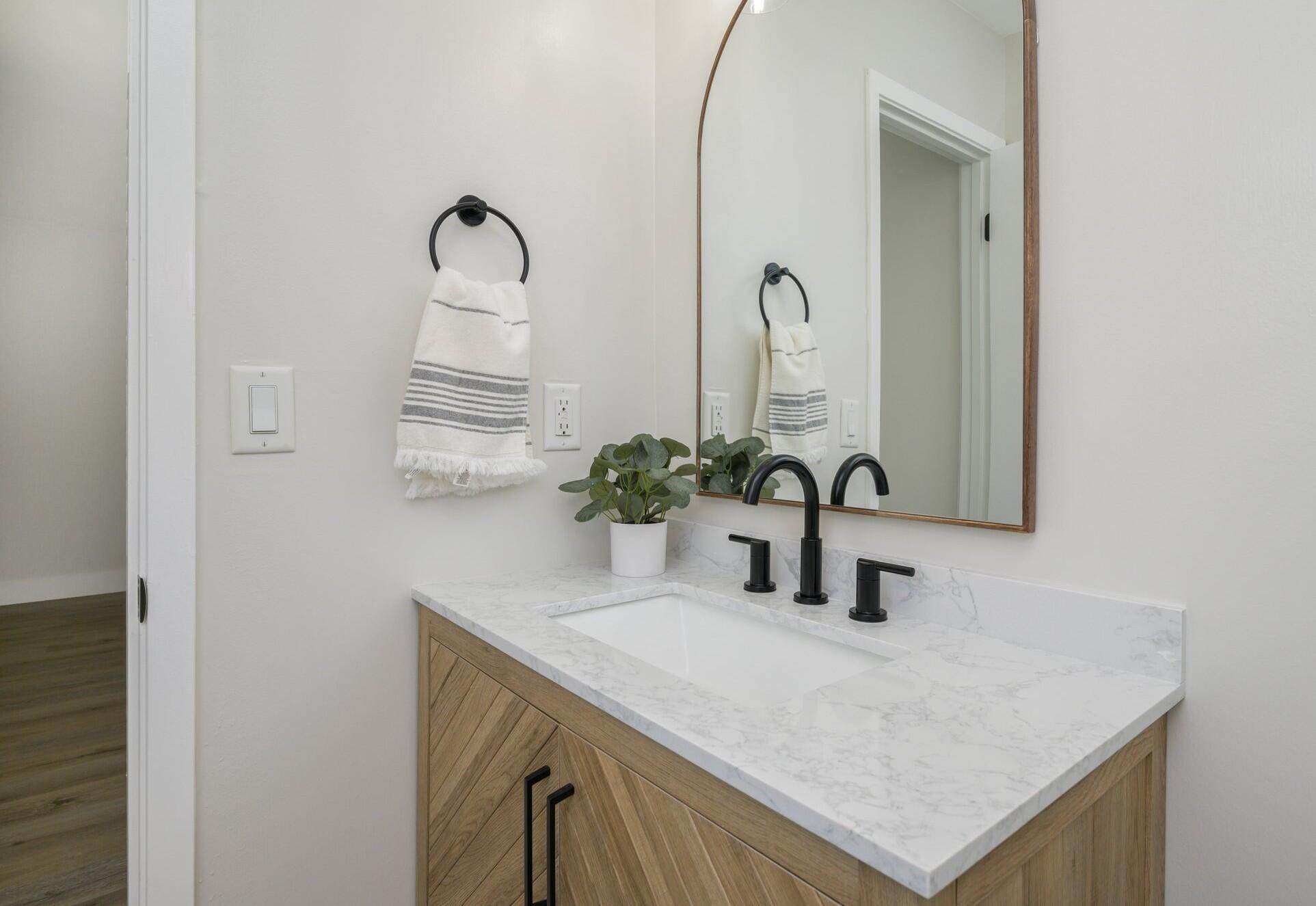79 11th Street Shalimar, FL 32579 - Photo 20 of 36 a bathroom with a sink and a mirror