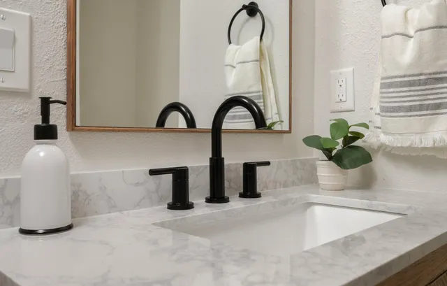 a bathroom with a bathtub and shower