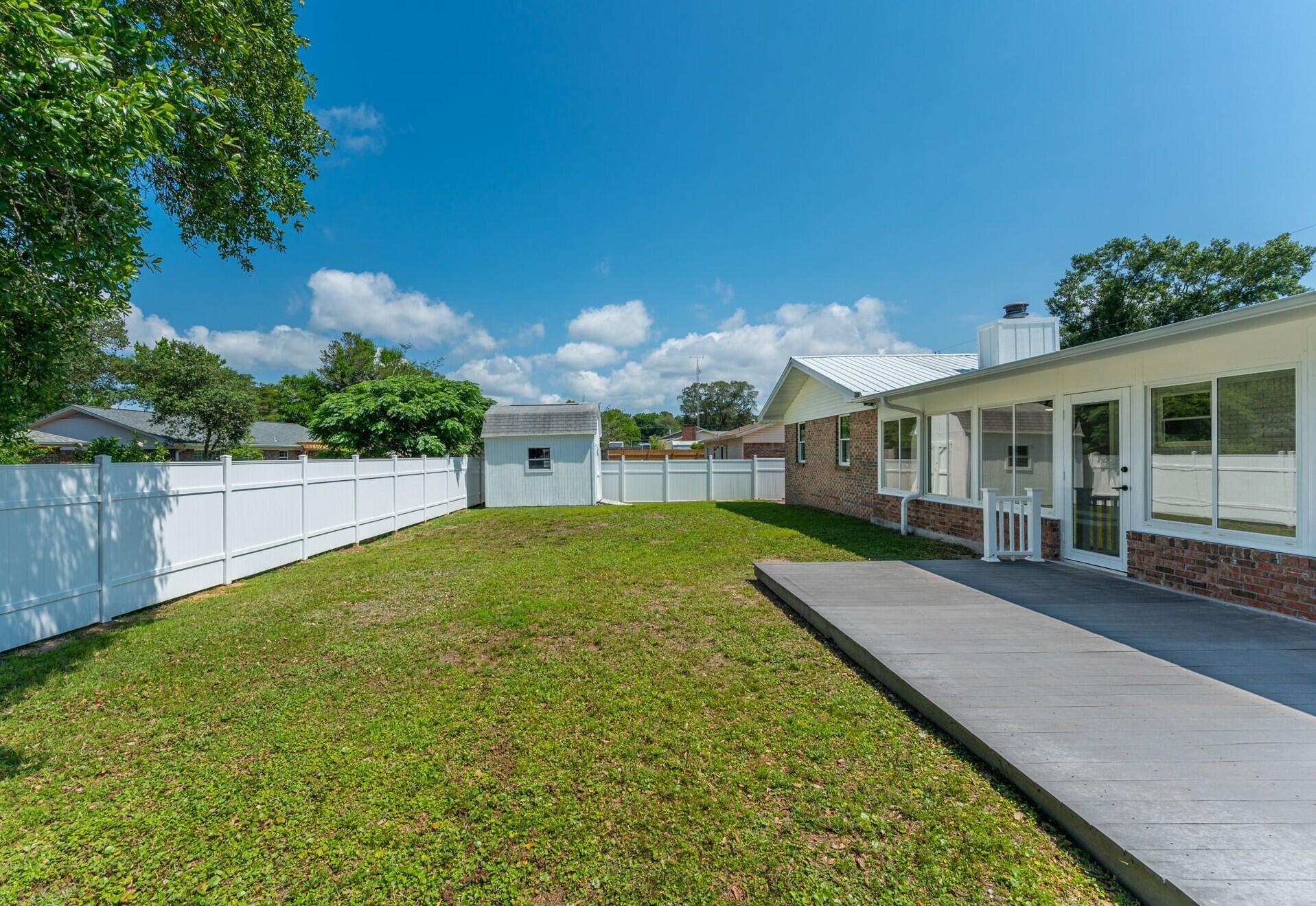 79 11th Street Shalimar, FL 32579 - Photo 31 of 36 a view of a house with backyard and porch