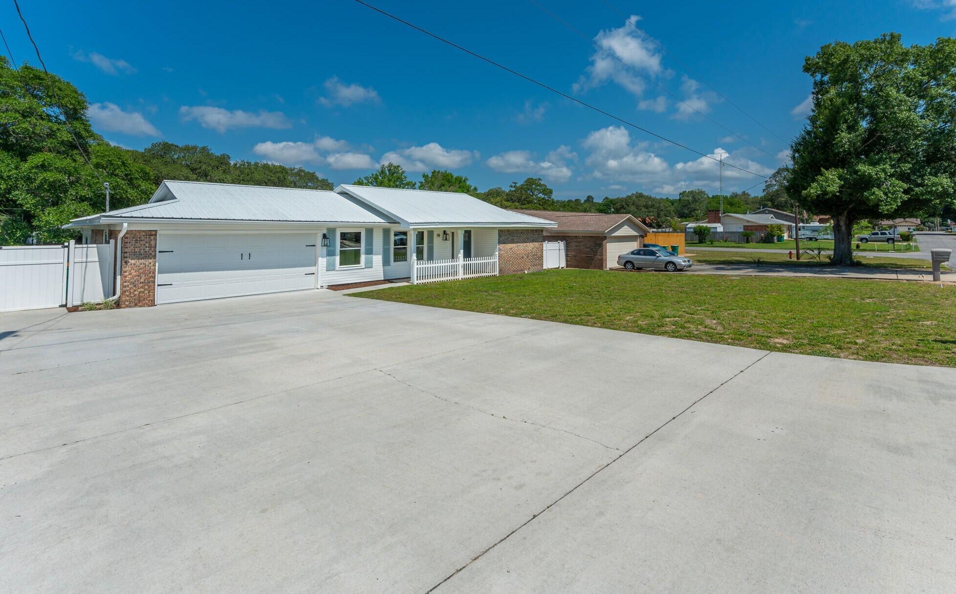 79 11th Street Shalimar, FL 32579 - Photo 33 of 36 front view of house with a yard