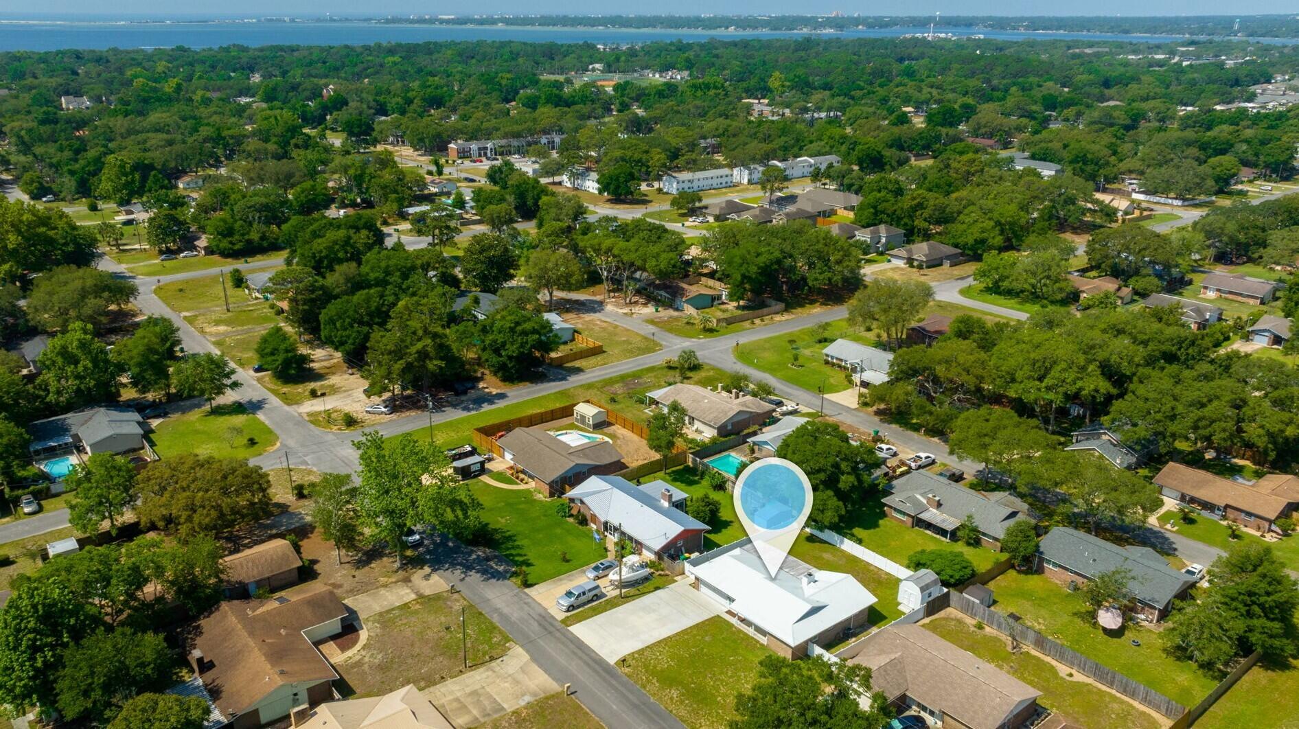 79 11th Street Shalimar, FL 32579 - Photo 36 of 36 an aerial view of residential houses with outdoor space and trees