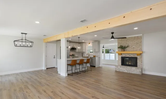 a view of kitchen with furniture and wooden floor