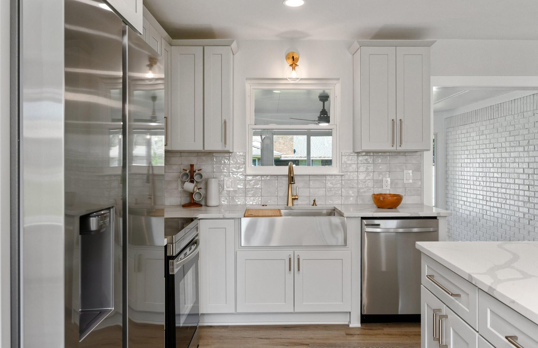 79 11th Street Shalimar, FL 32579 - Photo 10 of 36 a kitchen with a sink cabinets and stainless steel appliances