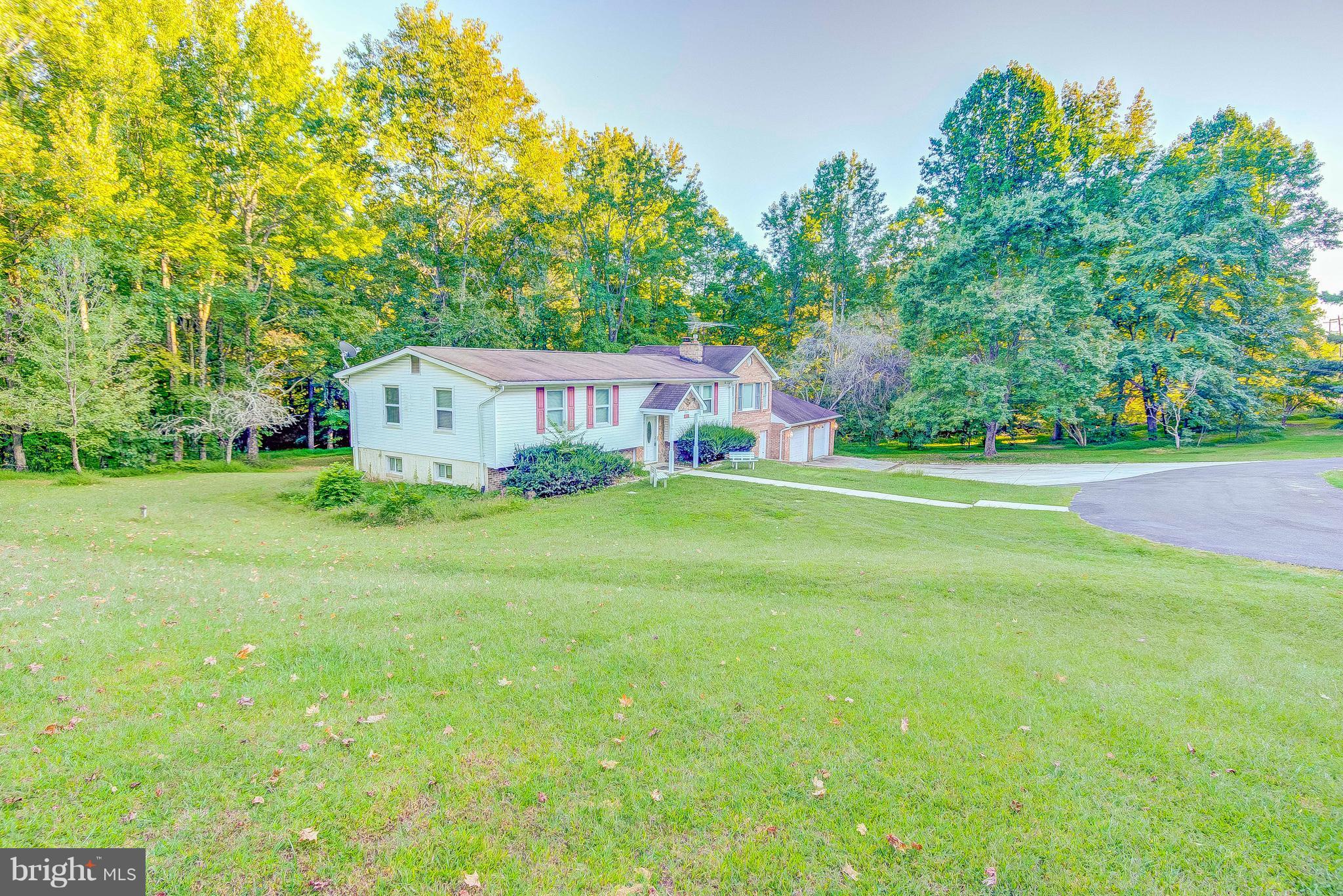 7031 Briscoe Turn Road Owings, MD 20736 - Photo 3 of 29 a house view with a garden space