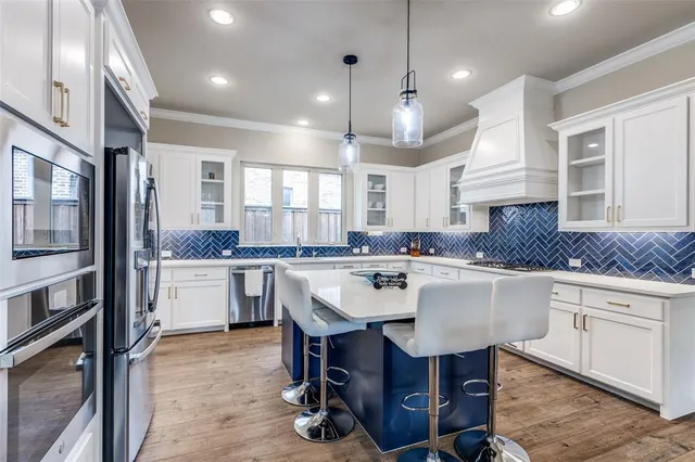 a kitchen with a sink cabinets and window