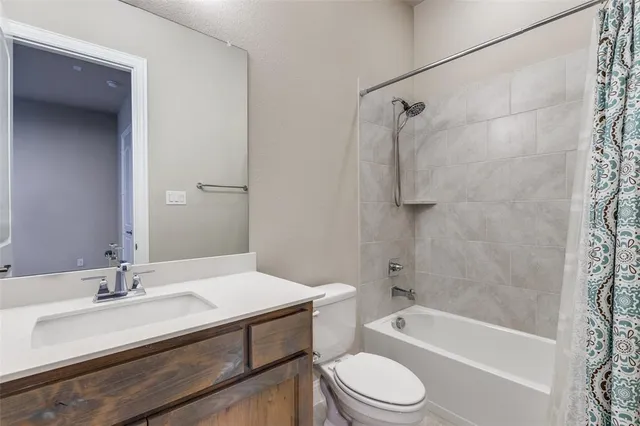 a bathroom with a sink a toilet and a bathtub