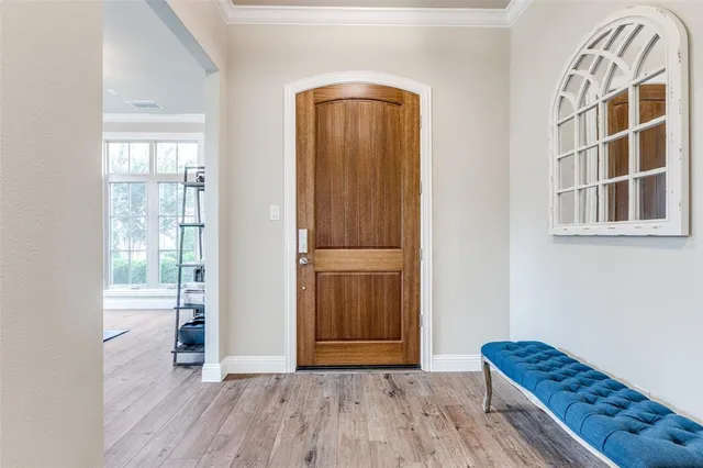 a view of front door with wooden floor