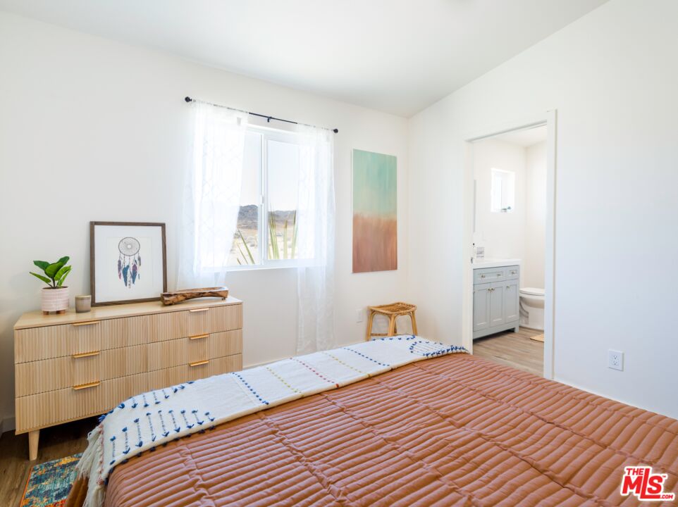 63618 2 Mile Road Joshua Tree, CA 92252 - Photo 12 of 28 a bedroom with a bed and a dresser