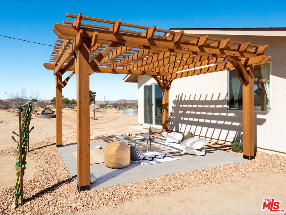 63618 2 Mile Road Joshua Tree, CA 92252 - Photo 19 of 28 a view of a house with a outdoor space