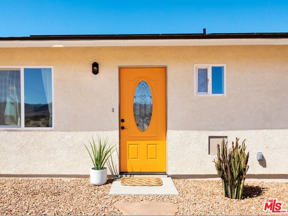 63618 2 Mile Road Joshua Tree, CA 92252 - Photo 2 of 28 a view of a door and chair
