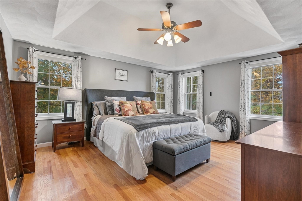 12 Cameron Way Methuen, MA 01844 - Photo 17 of 42 a bedroom with a bed and a chandelier