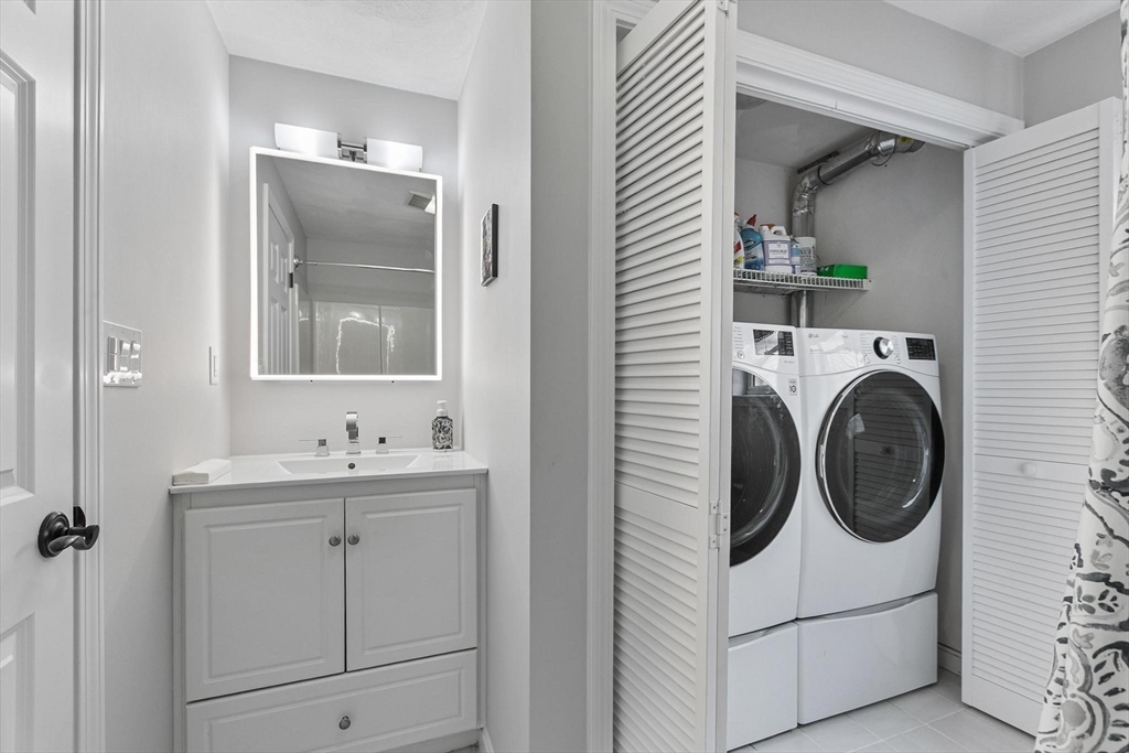 12 Cameron Way Methuen, MA 01844 - Photo 22 of 42 a utility room with sink dryer and washer