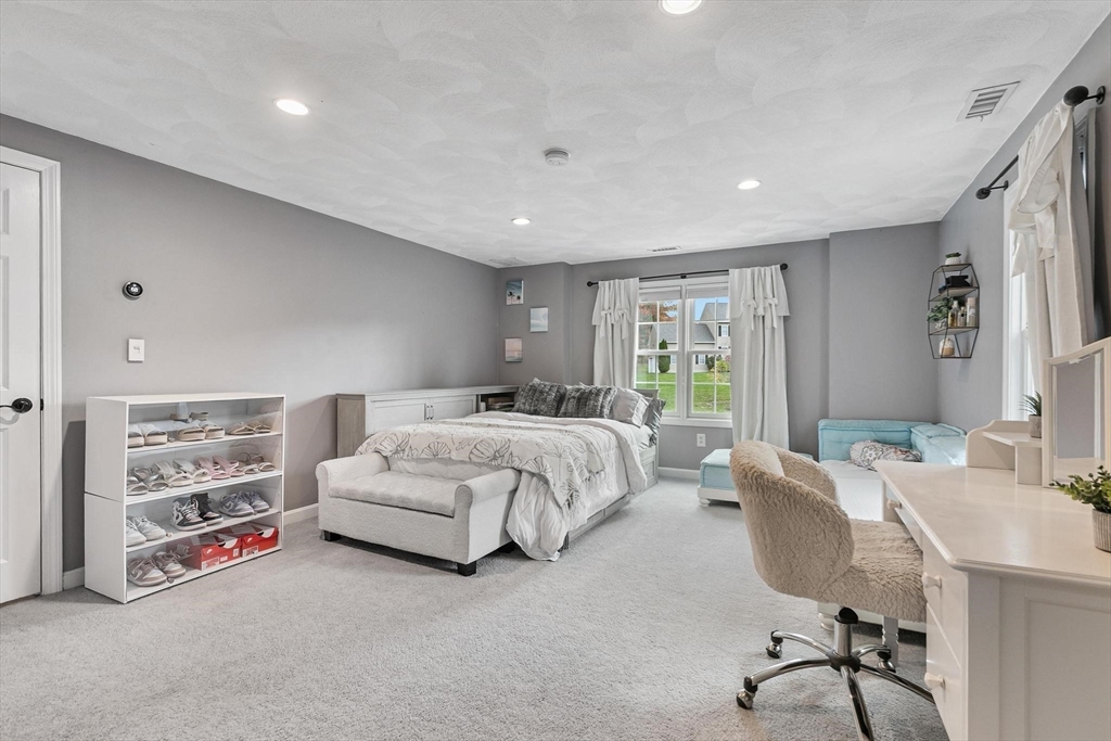12 Cameron Way Methuen, MA 01844 - Photo 24 of 42 a bed room with a bed and a desk