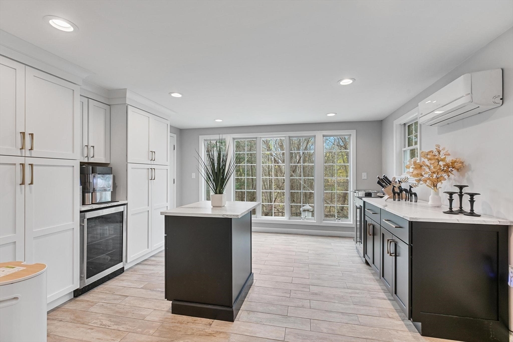 12 Cameron Way Methuen, MA 01844 - Photo 8 of 42 a kitchen with kitchen island a sink appliances and cabinets