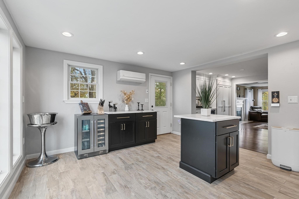 12 Cameron Way Methuen, MA 01844 - Photo 9 of 42 a kitchen with stainless steel appliances kitchen island granite countertop a stove refrigerator and cabinets