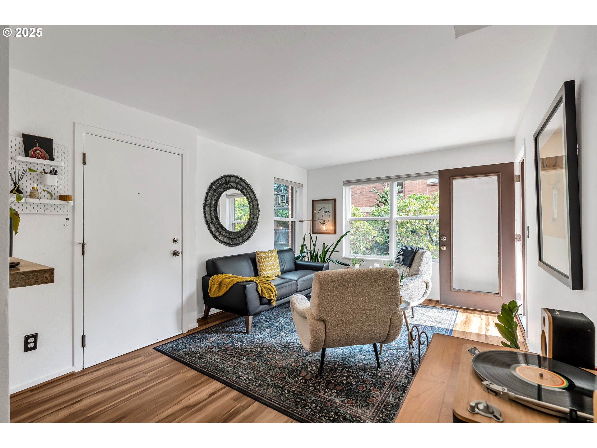 1500 Southwest Park Avenue, Unit 232 Portland, OR 97201 - Photo 11 of 40 a living room with furniture and a flat screen tv