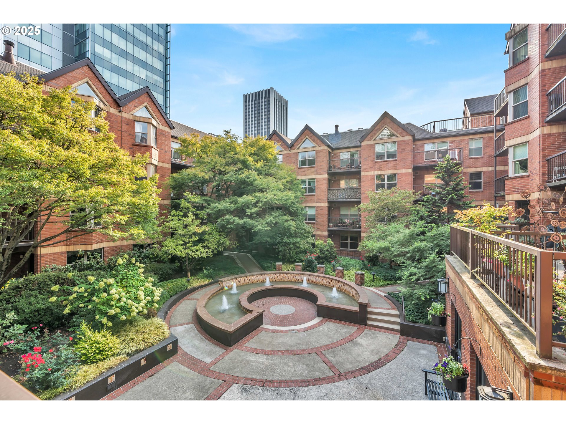 1500 Southwest Park Avenue, Unit 232 Portland, OR 97201 - Photo 13 of 40 a view of a multi story residential apartment building with a yard and plants