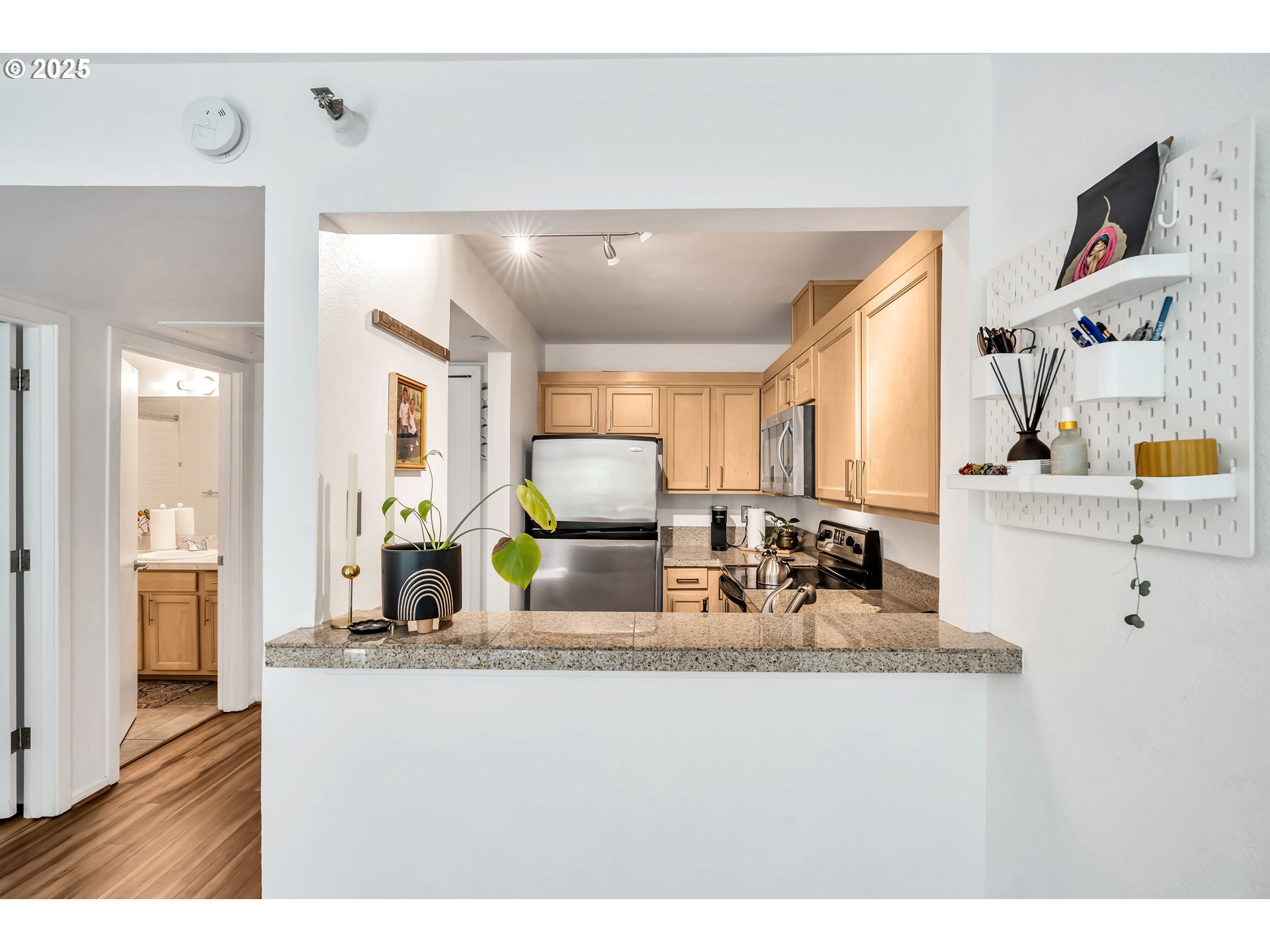 1500 Southwest Park Avenue, Unit 232 Portland, OR 97201 - Photo 14 of 40 a view of living room with granite countertop furniture and fireplace