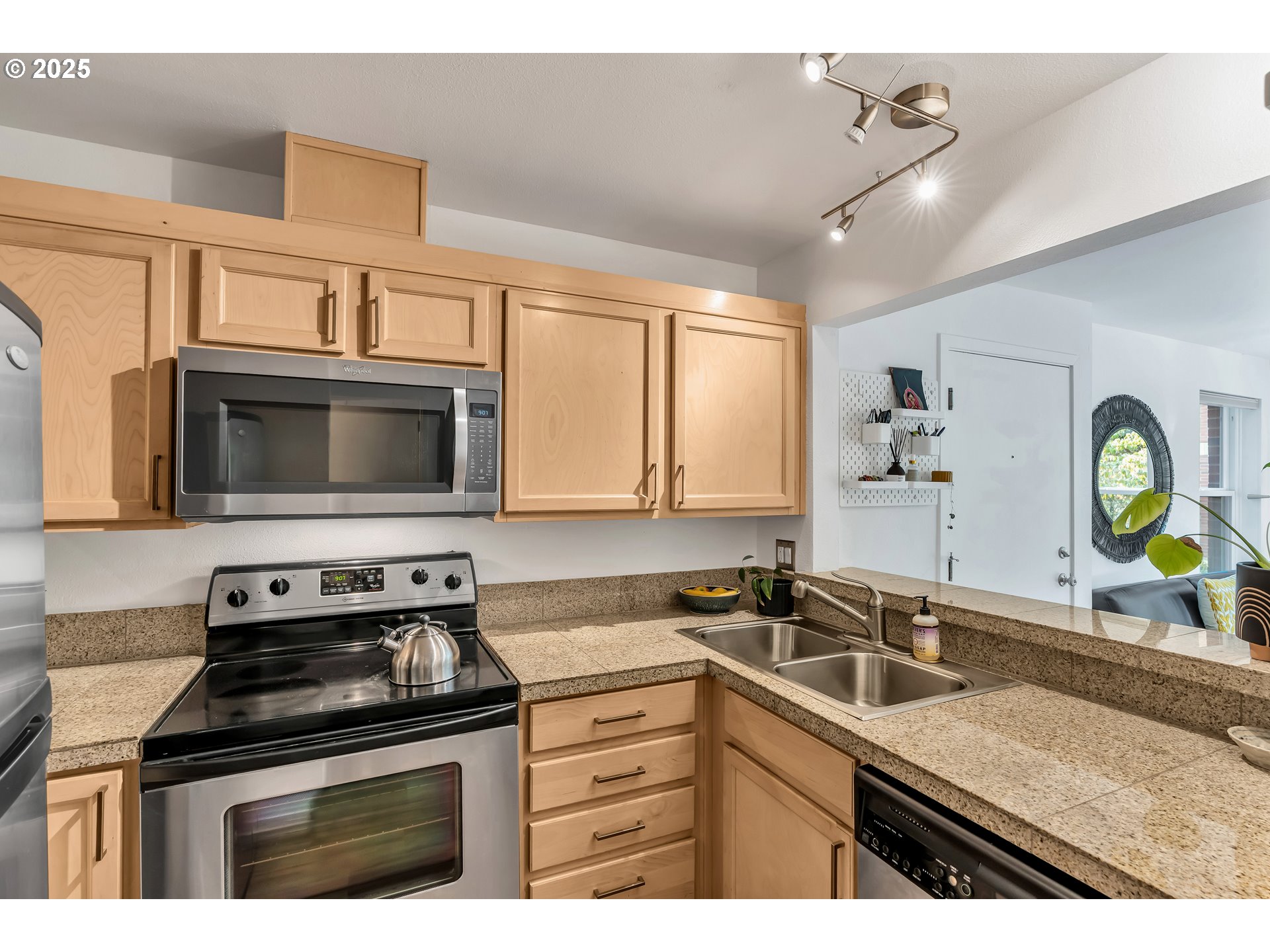 1500 Southwest Park Avenue, Unit 232 Portland, OR 97201 - Photo 16 of 40 a kitchen with stainless steel appliances granite countertop a sink stove and cabinets