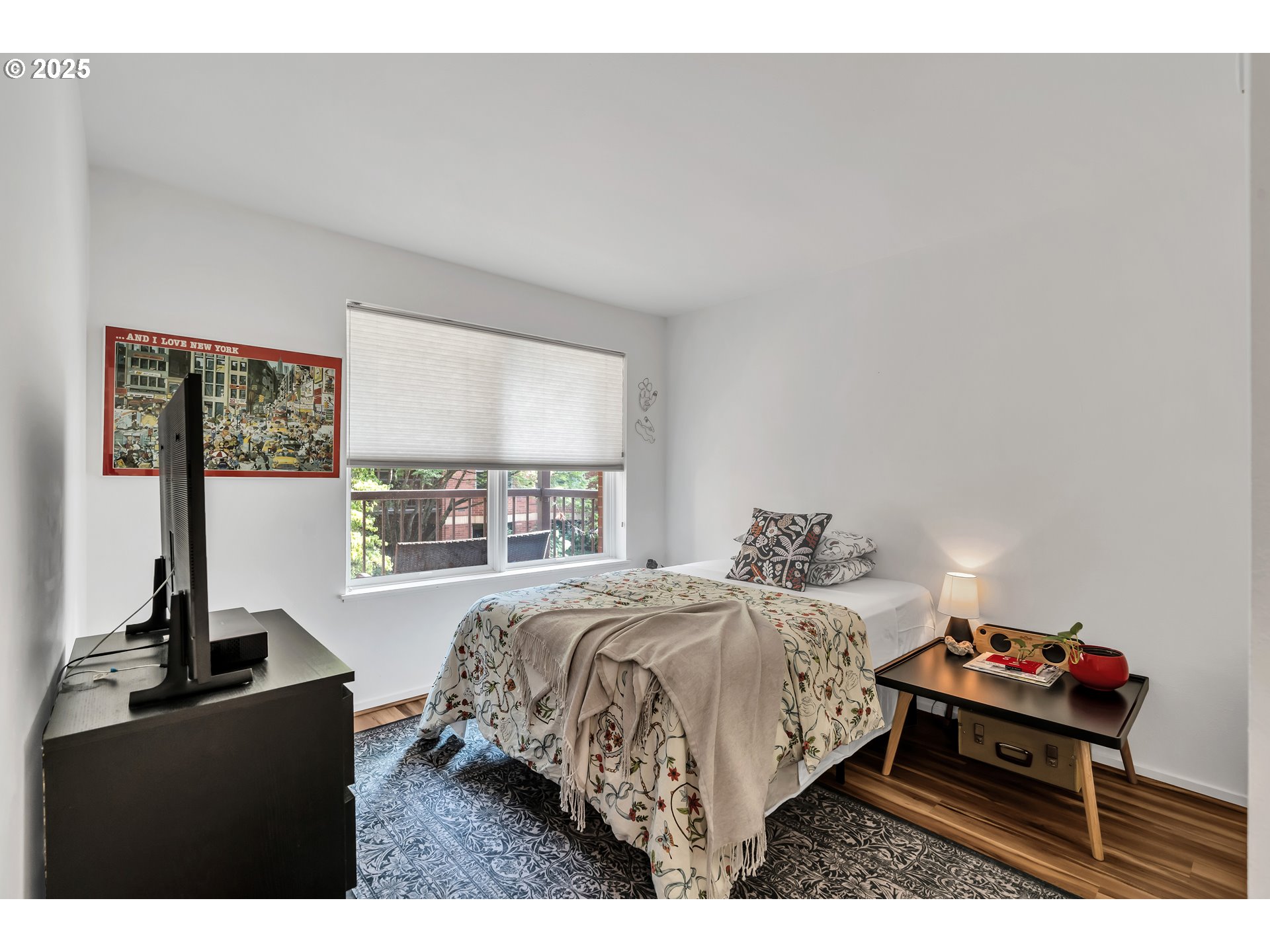 1500 Southwest Park Avenue, Unit 232 Portland, OR 97201 - Photo 20 of 40 a bedroom with a bed dresser and a window