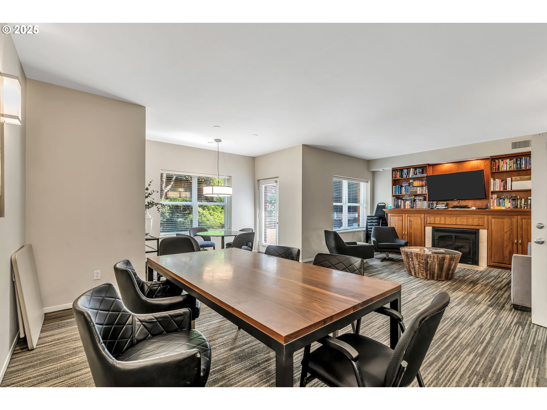 1500 Southwest Park Avenue, Unit 232 Portland, OR 97201 - Photo 22 of 40 a living room with furniture a fireplace and a large window